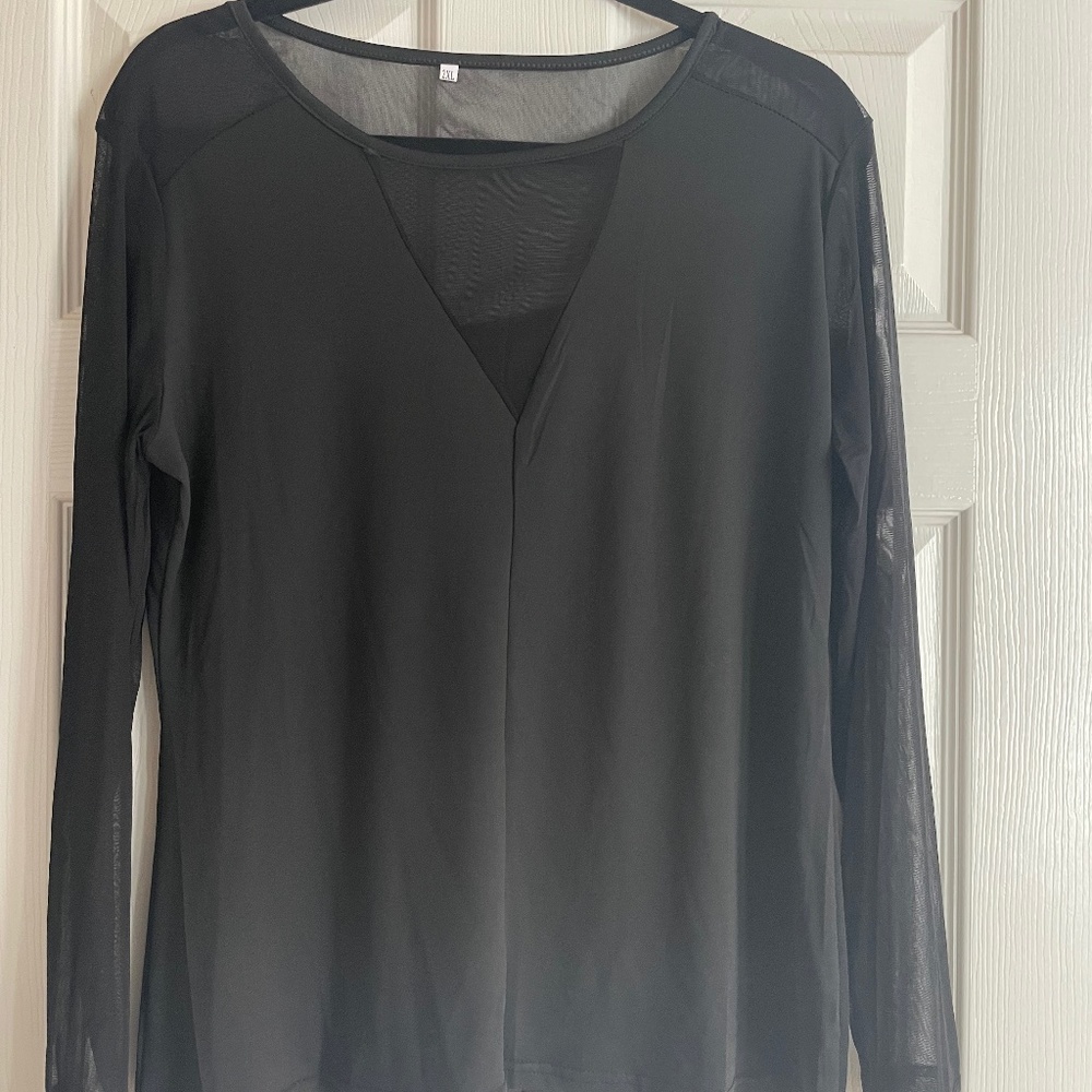 Ladies black long sleeved top with mesh cut outs